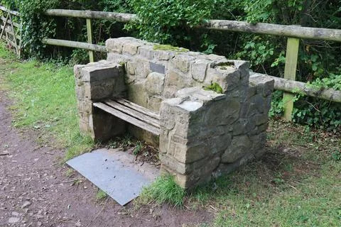 The very solid looking block and timber millennium seat in the village of Eas Stock Photos