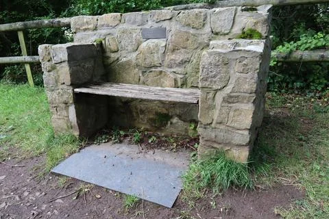 The very solid looking block and timber millennium seat in the village of Eas Stock Photos