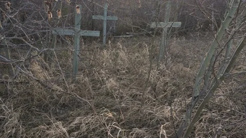 Very somber graveyard scene with old wooden crosses in the background Stock Footage 155129145