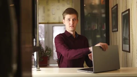 Very successfull buisnessman using his notebook, typing and look funny Stock Footage 148043285