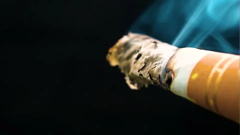 Very tiny bit of a cigarette almost at the end of the filter burning Video stock 253138531