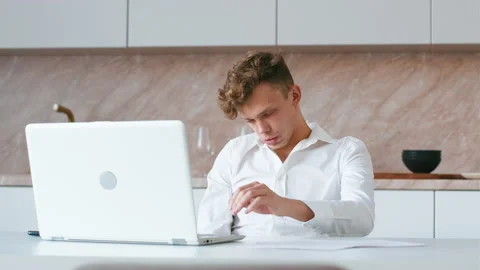 Very tired guy trying to work on laptop Stock Footage 206380000