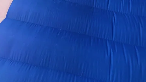 A very unique and close shot of a paragliding instructor flying over a Stock-Footage 130264501