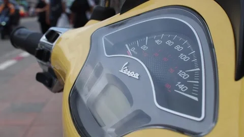 Vespa speedometer dashboard panel parking on side walk. Pedestrian walking Stock Footage 279963207