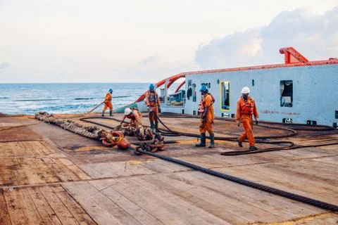 Vessel crew preparing vessel for static tow tanker lifting Stock Photos