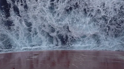 Vessel cuts gale ocean surface and creates fantastic waves Stock Footage 117781227