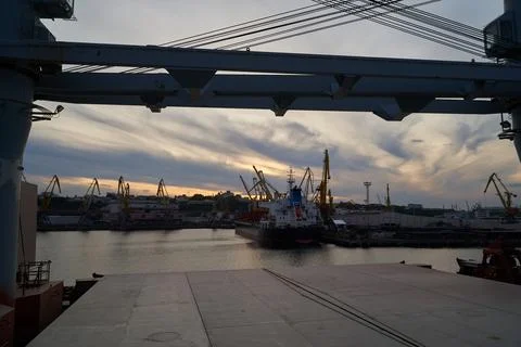 Vessel dry cargo on loading, unloading in port. Bulker in port. Stock Photos