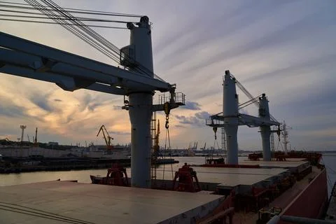 Vessel dry cargo on loading, unloading in port. Bulker in port. Stock Photos