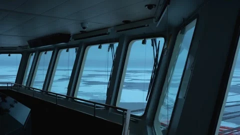 Vessel in ice. View from navigation bridge through big windows. Frozen sea Stock Footage 260470336