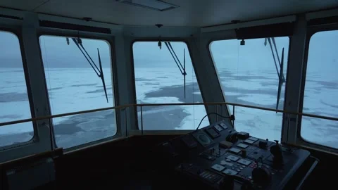 Vessel in ice. Winter view through windows of navigation bridge. Control panel Stock Footage 258012912