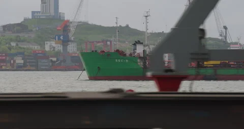 Vessel moves through water under sky with faint sunlight Stock Footage 319832122
