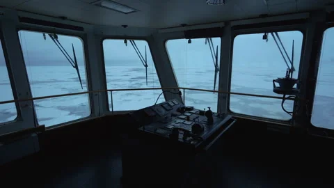Vessel. Snow view through windows of navigation bridge. Control panel on wing Stock Footage 255155560
