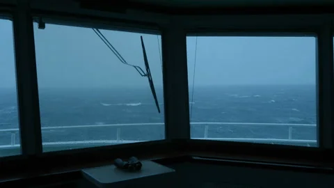 Vessel in storm. Splashes of water from bow fall on glass of ship's bridge Stock Footage 219020720