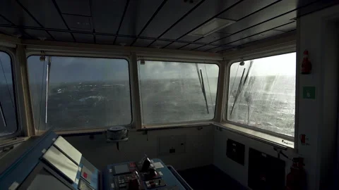 Vessel in storm. View from navigating bridge. Splashes on windows. Glass washers Stock Footage 255131744