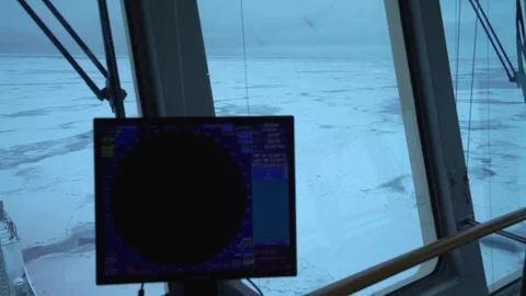 Vessel. View from navigation bridge to frozen sea. Radar screen in foreground Stock Footage 255244591