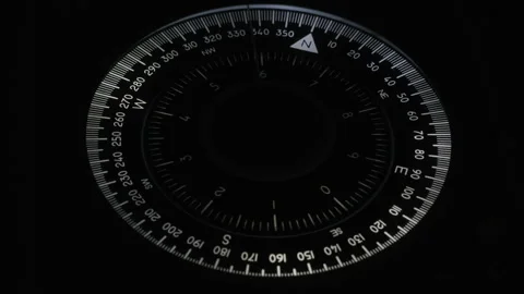 Vessel's compass. Needle almost to north. Scale with numbers spinning. Black Stock Footage 219818868