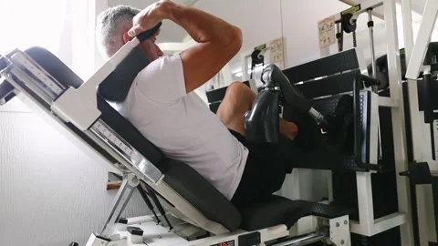 Veteran amputee athlete doing sit-ups on the bench Stock Footage 276948033