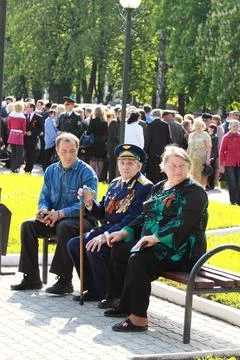 Veterans of the Second World War with bouquets of flowers at the Victory Da.. Stock Photos