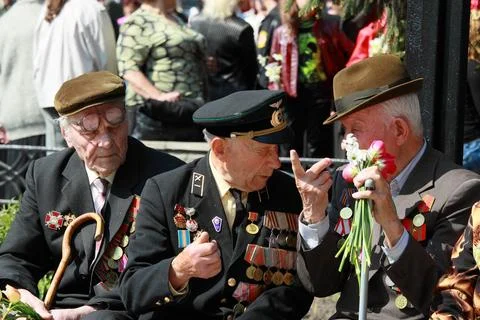 Veterans of the Second World War with bouquets of flowers at the Victory Da.. Stock Photos