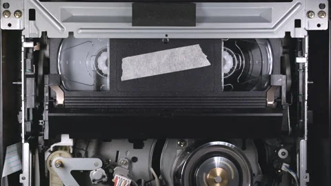 VHS cassette insert in VCR, play from beginning, then eject at the end of tape Stock Footage