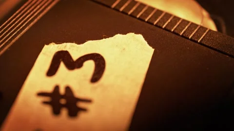 VHS Cassette Label on Playing Video Tape in Macro Stock Footage 272876541
