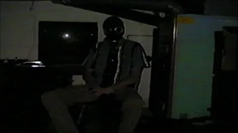 VHS dim sitting and staring Stock Footage 274082688
