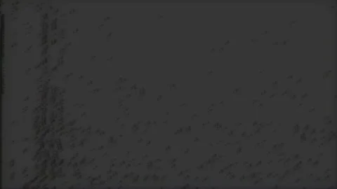 VHS flickering grain noise overlay with saturated color corruption and analog Video stock 334823197