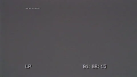 VHS. An old bad VHS tape playing. Old gray screen with timecode. VHS effect Stock Footage 154466701
