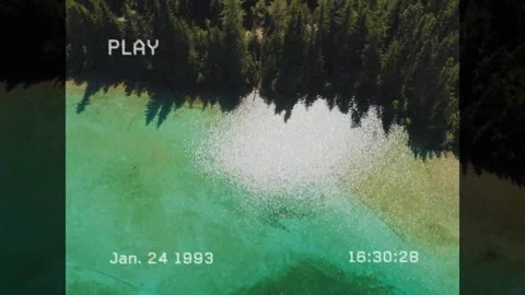 VHS PLAY starting, timestamp ticking, camera pulling up showing green water 스톡 동영상 330142660