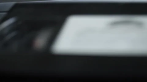 VHS Player-insert VHS press play MVI-4715 Stock Footage 1042801