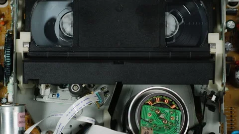 VHS PLAYER, Old video recorder inside close-up, VHS. Retro player in neon blue Stock Footage 258381765
