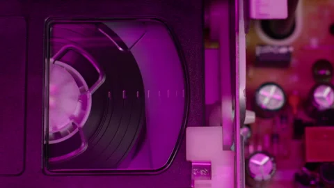 VHS PLAYER, Old video recorder inside in neon pink light close-up, VHS. Retro Stock Footage 261917668