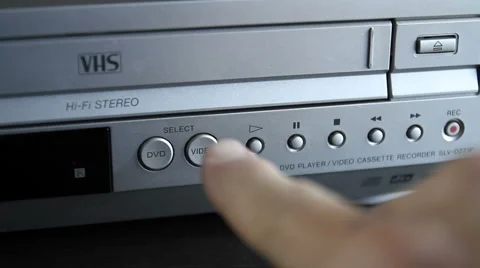 VHS Player-select DVD &amp; VHS buttons MVI-4715 Stock Footage 1042759