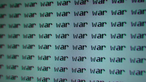 VHS retro look of many printed words "war" on the screen of an old TV or monitor Stock Footage 169146298