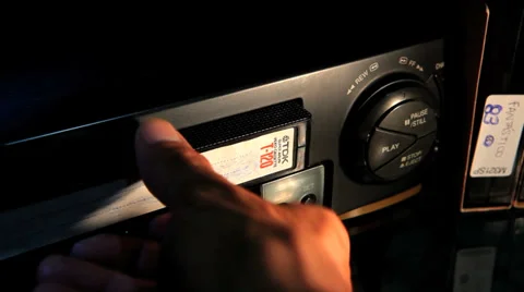 VHS tape being ejected from a VCR 8 Stock Footage 34677899