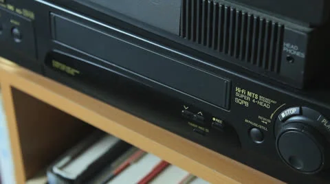 VHS TAPE BEING INSERTED AND EJECTED Video stock 22952503