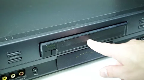 VHS tape being inserted into a VHS machine 스톡 동영상 46892145