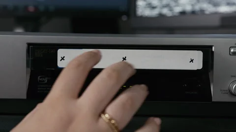 VHS Tape Inserted and Ejected from a VCR. Female Hand. Motion Trackers Stock Footage 137434991