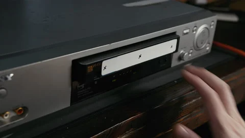 VHS Tape Inserted and Ejected from a VCR. Male Hand. Motion Trackers. Stock Footage 137439018