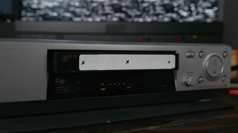 VHS Tape Inserted and Ejected from a VCR. Male Hand. Motion Trackers. VFX Plate Stock Footage 137443791
