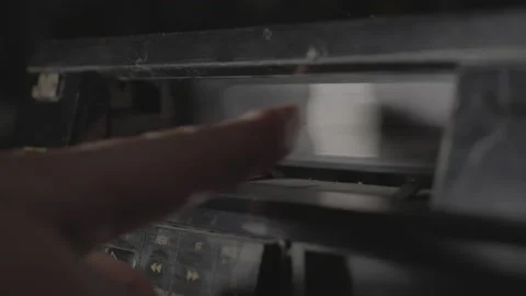 VHS tape placed into Deck Close Up 動画素材 130336965