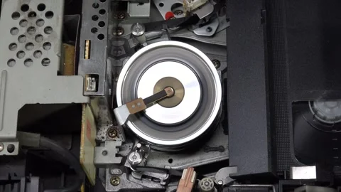 VHS tape in the player with close up on the head drum - PLAY and EJECT movem Stock Footage 315273785