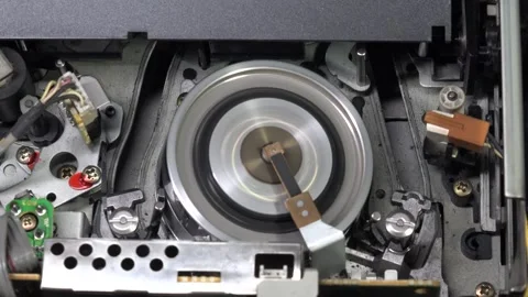 VHS tape in the player with close up on the head drum - PLAY and EJECT movem Stock Footage 315274145