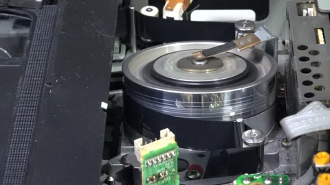 VHS tape in the player with close up on the head drum - PLAY and EJECT movem Stock Footage 315274203