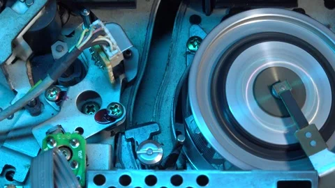 VHS tape in the player with close up on the head drum - PLAY and EJECT movem Stock Footage 315274262