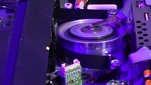VHS tape in the player with close up on the head drum - PLAY and EJECT movem Stock Footage 315275652