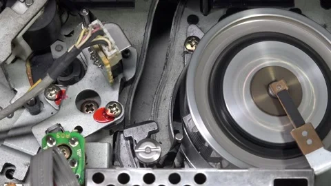 VHS tape in the player with close up on the head drum - PLAY and EJECT movem Stock Footage 315282418