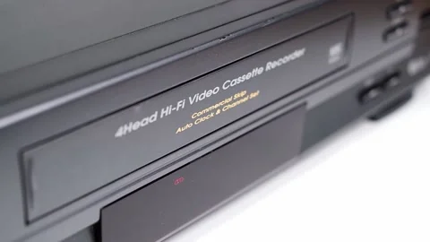 VHS VCR Deck with VHS Tape Being Inserted and Ejected Stock Footage 139737354