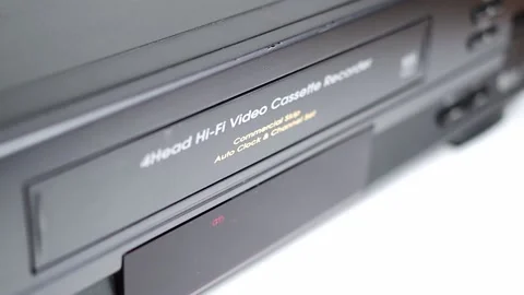 VHS VCR Deck with VHS Tape Being Inserted and Ejected Stock Footage 139737362