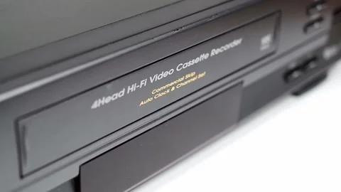 VHS VCR Deck with VHS Tape Being Inserted and Ejected Stock Footage 139737363